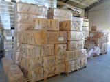 a large stack of boxes sitting on a pallet in a warehouse