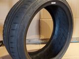 an image of a tire sitting on top of a cardboard box
