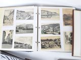an open book with pictures of a city on it