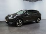 2017 nissan rav in a showroom with white walls and black flooring