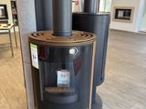 a wood burning stove in the middle of a room
