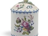 an image of a decorative container with flowers on it