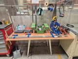 a workbench with tools on top of it in a garage