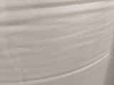 a toilet with a roll of toilet paper on it