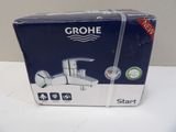 a box of grohe bathroom faucets on a table