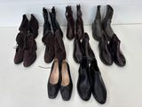 Plusieurs paires de chaussures sont alignées sur une surface blanche