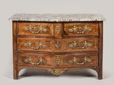 a marble top chest of drawers on display