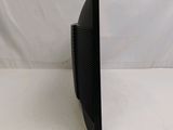 an image of a black computer monitor on a white surface