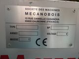 a picture of a machine that has a sign on it