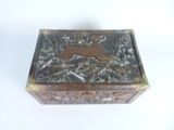 a wooden box with a deer on it on a white surface