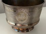 a silver bowl that is sitting on a table