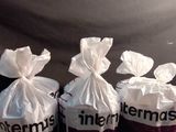several bags of food sitting on top of a wooden table