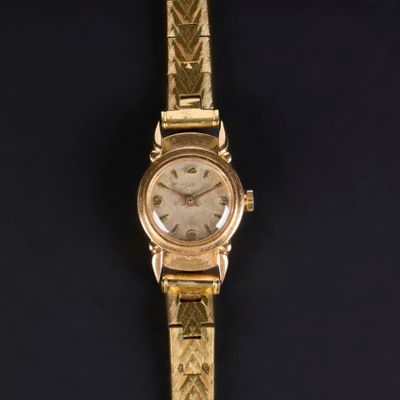 . LIP. Montre de dame en or, cadran rond, bracelet en métal,…