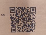 a picture of a qr code on a cardboard box