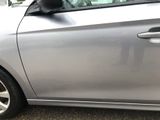 a silver car that is parked in a parking lot