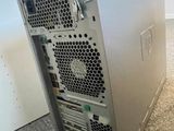 a silver computer tower sitting on the floor in a room