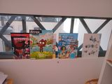 a lot of books on the window sill in this room
