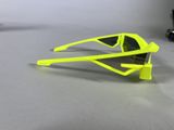 neon yellow sunglasses on a table with a pair of black sunglasses