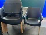 two chairs that are next to each other in a room