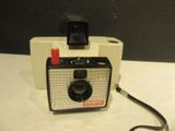 a polaroid camera sitting on top of a table