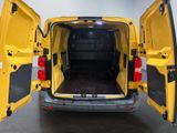 a yellow van with its doors open in a garage