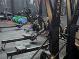 a gym with a lot of equipment in the room