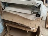 a pile of cardboard and cardboard boxes on the floor