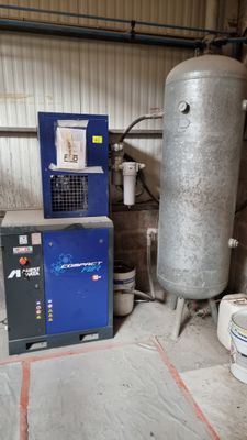 a tank and a water heater in a room