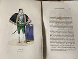 an open book with a picture of a man holding a sword