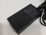 an image of a laptop charger sitting on top of a white table