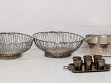 a lot of silver items that are on the table