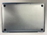 a close up of a laptop with a metal cover on top of it