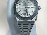 an image of a watch is displayed on a stand on a white surface