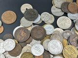 a lot of coins that are on the table