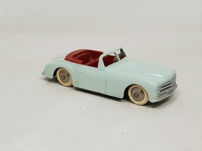 a toy car that is sitting on a white surface