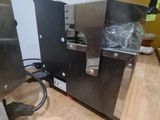 a machine that is sitting on top of a wooden table