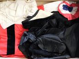 a box full of clothing that is sitting on the floor