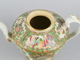 a vase with a handle that has a painting on it