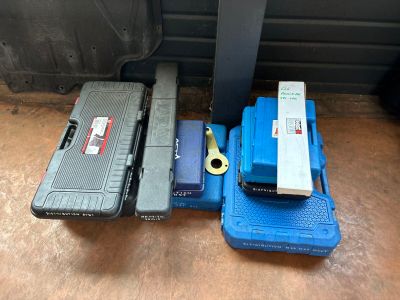 many different types of tools sitting on the floor