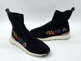 the shoes are black with multicolored letters on them