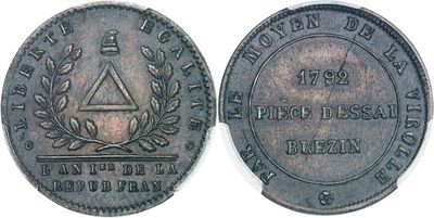 a close up of a coin on a white surface