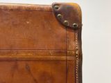 a piece of luggage sitting on top of a wooden table