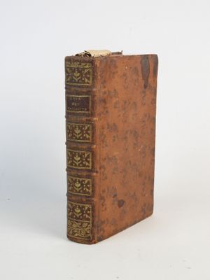 an old book that is sitting on a table