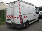 a white van that is parked on the side of the road