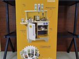 a cardboard box with a picture of a kitchen set inside of it
