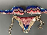 two piece swimsuit with multicolored pattern on top and bottom