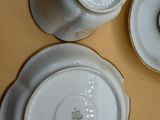 three cups and saucers sitting on a table