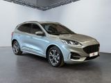 a silver ford escape parked in a showroom