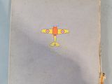 a book with a drawing of a yellow airplane on it
