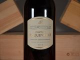 a bottle of wine that is sitting on a table